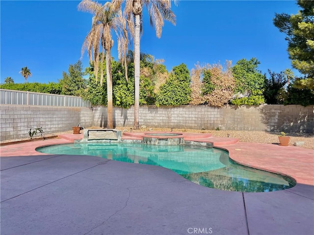 view of swimming pool with an in ground hot tub and a patio