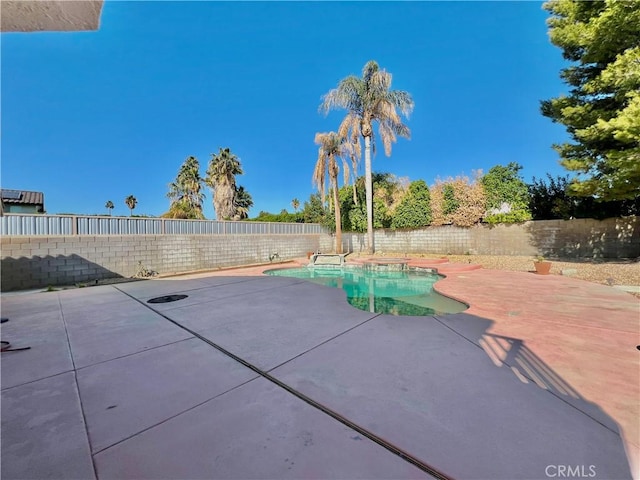 view of patio / terrace featuring a fenced in pool