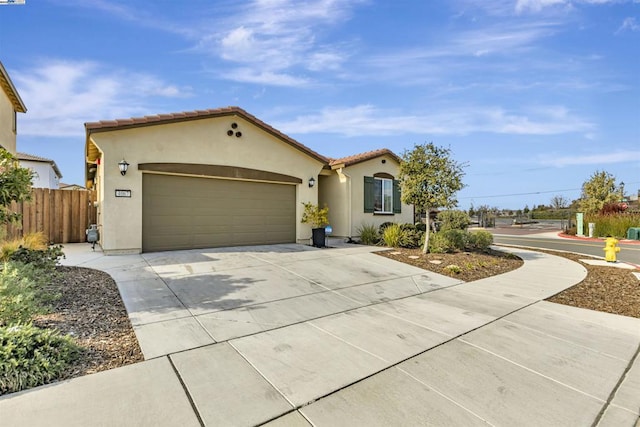 mediterranean / spanish house featuring a garage