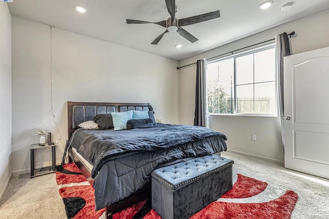 carpeted bedroom with ceiling fan