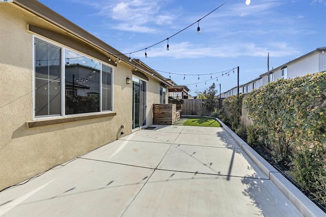 view of side of home featuring a patio