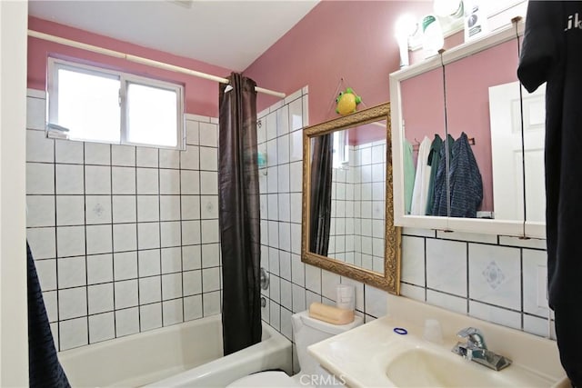 full bathroom featuring vanity, tile walls, shower / bath combination with curtain, and toilet