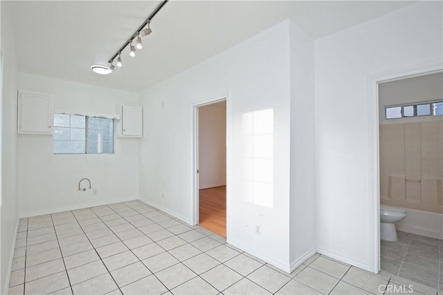 unfurnished room featuring light tile patterned floors