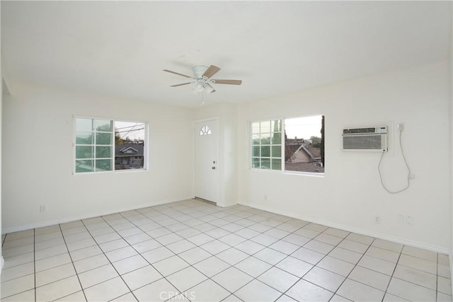 unfurnished room with a wall mounted air conditioner and ceiling fan