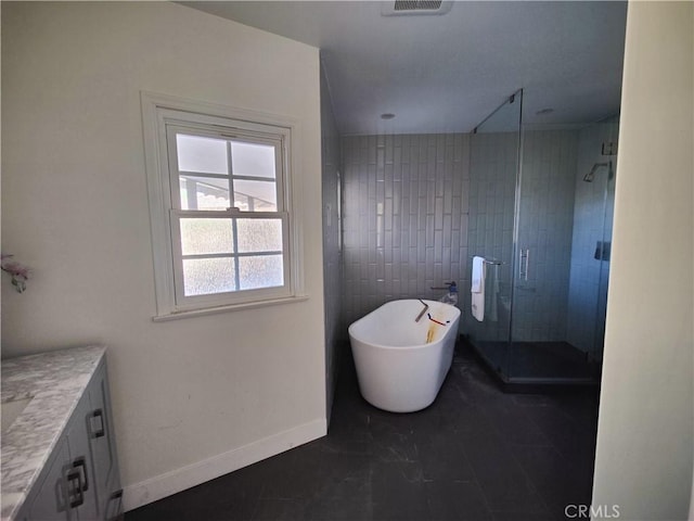 bathroom featuring vanity and independent shower and bath