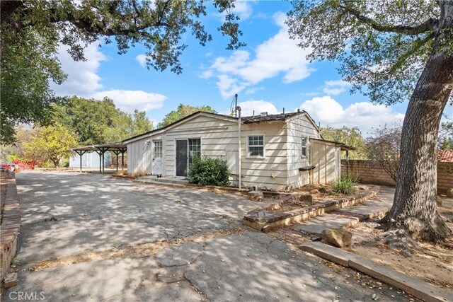 exterior space featuring a carport