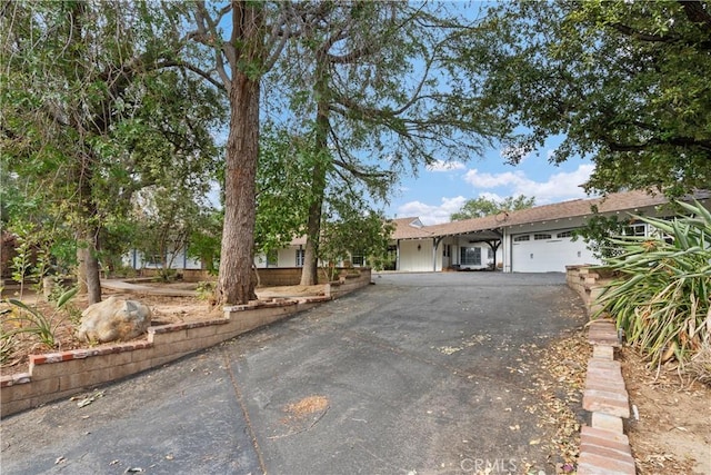 ranch-style home featuring a garage