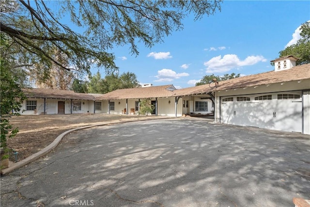 single story home with a garage