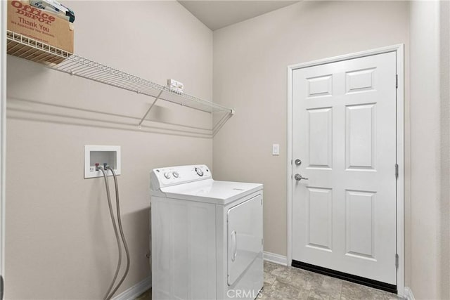 clothes washing area featuring washer / dryer