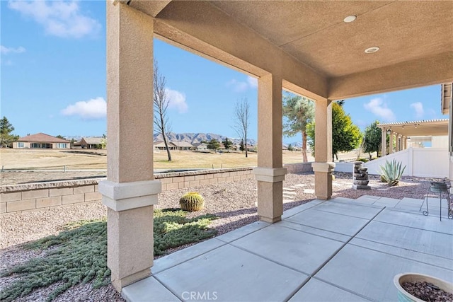 view of patio / terrace with a mountain view