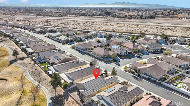 birds eye view of property with a mountain view