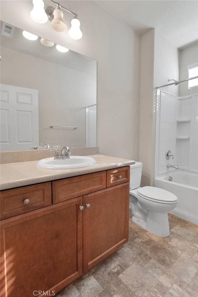 full bathroom with vanity, bathtub / shower combination, and toilet