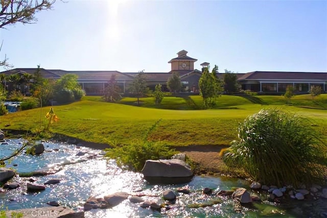 view of home's community featuring a lawn