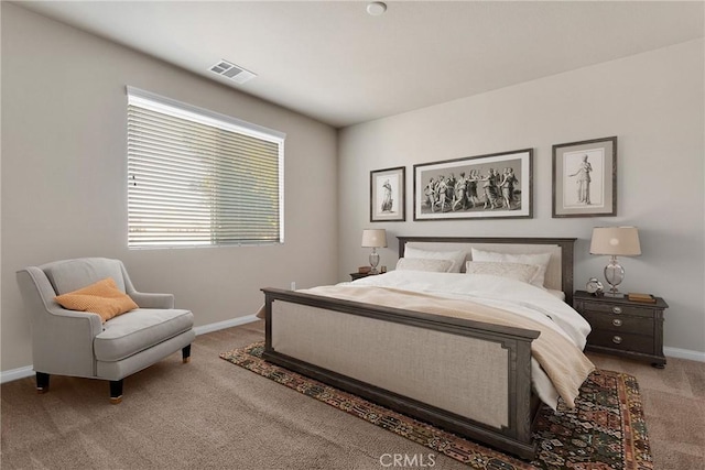 bedroom with light colored carpet