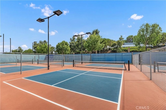 view of sport court with basketball hoop