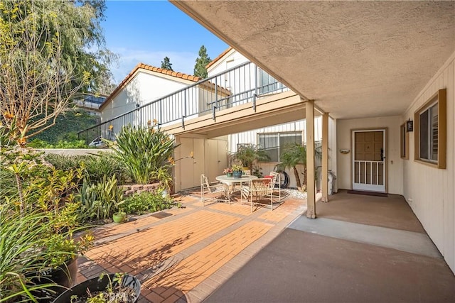 view of patio / terrace with a balcony