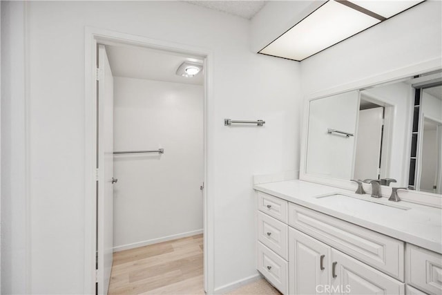 bathroom featuring vanity and hardwood / wood-style floors