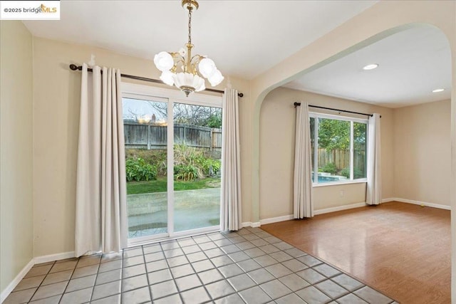 entryway with a chandelier and light hardwood / wood-style floors