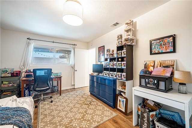 office space with hardwood / wood-style flooring