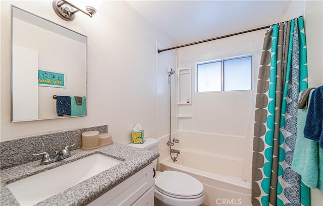 full bathroom featuring vanity, toilet, and shower / bath combo with shower curtain