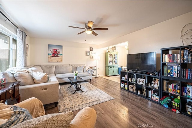 living room with hardwood / wood-style flooring and ceiling fan