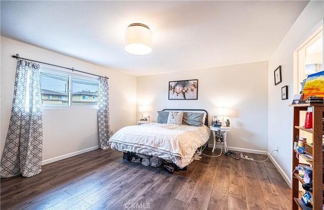 bedroom with dark wood-type flooring