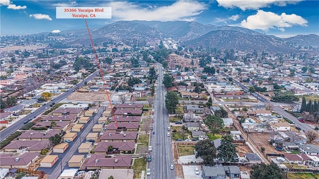 drone / aerial view featuring a mountain view