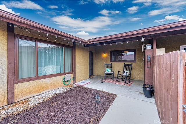 property entrance with a patio