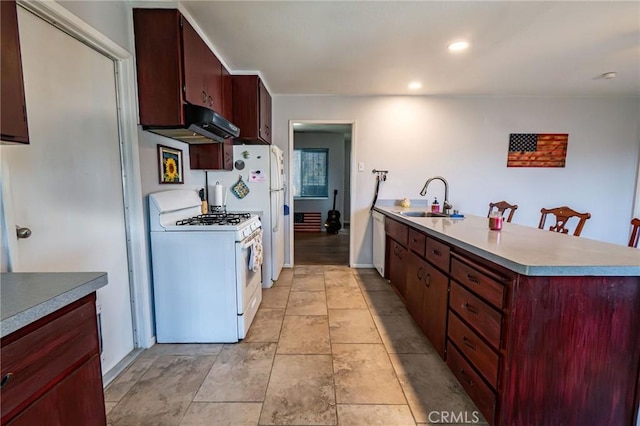 kitchen featuring dishwasher, sink, and gas range gas stove