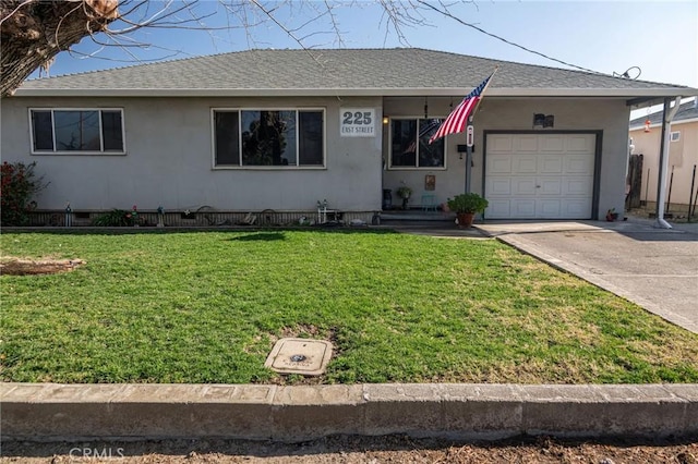 ranch-style house with a garage and a front yard