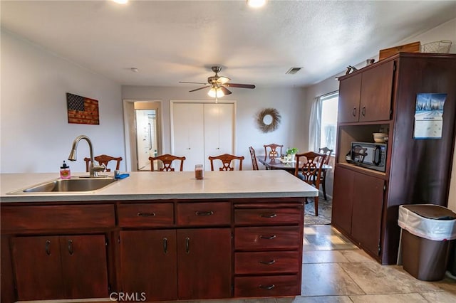 kitchen with ceiling fan and sink