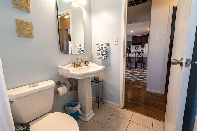 bathroom with tile patterned floors and toilet