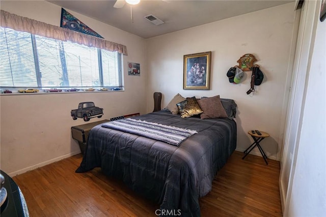 bedroom with hardwood / wood-style flooring and ceiling fan