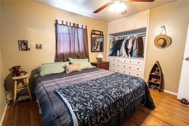 bedroom featuring hardwood / wood-style flooring, a closet, and ceiling fan