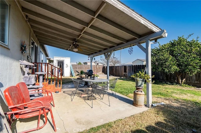 view of patio / terrace featuring a playground and ceiling fan