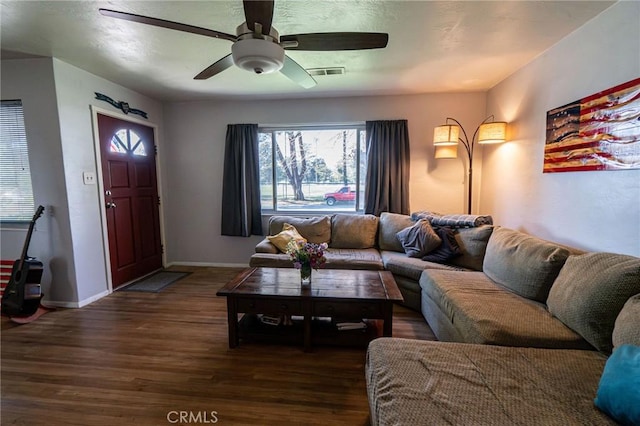 living room featuring dark hardwood / wood-style floors and ceiling fan