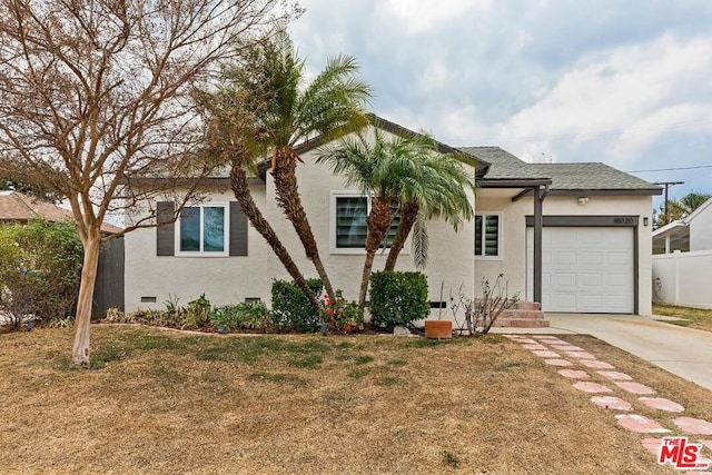 view of front of house with a garage and a front yard