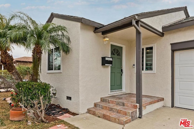 entrance to property featuring a garage