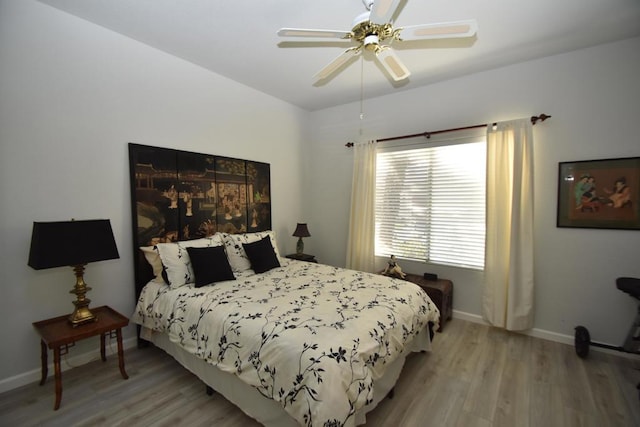 bedroom with ceiling fan and light wood-type flooring