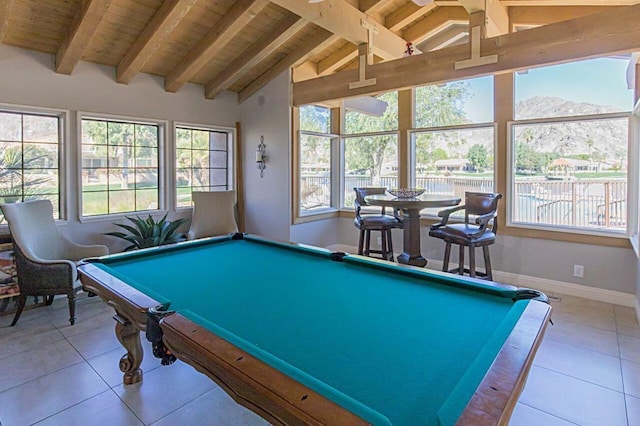 rec room with light tile patterned floors, wood ceiling, vaulted ceiling with beams, a mountain view, and pool table