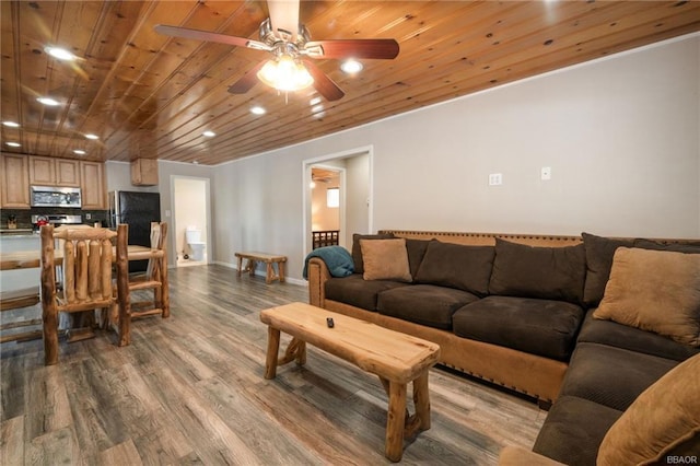 living room featuring ceiling fan, light wood-type flooring, and wooden ceiling