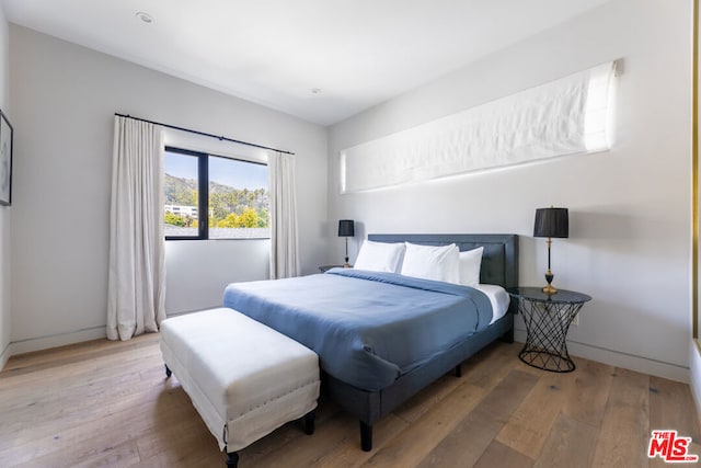 bedroom featuring hardwood / wood-style floors