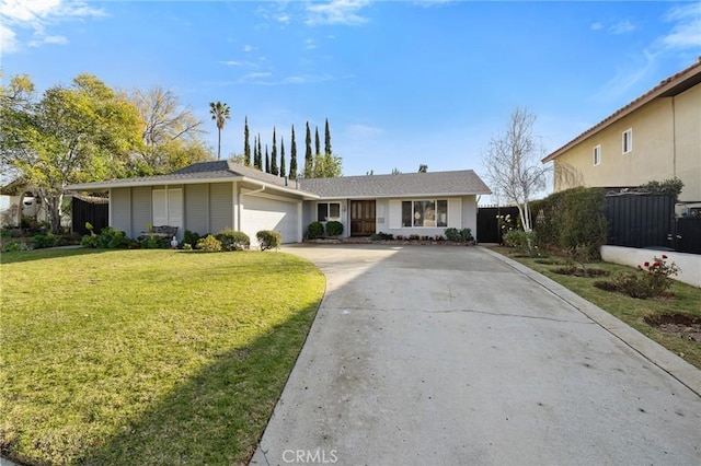 ranch-style home with a garage and a front yard