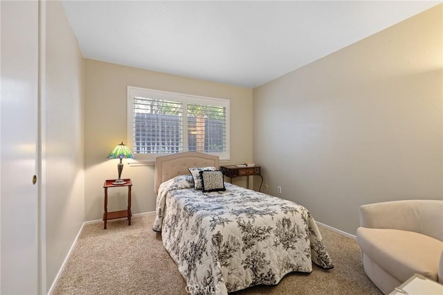 bedroom featuring light carpet