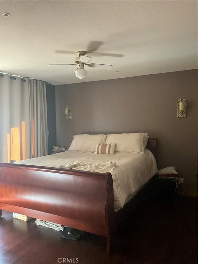 bedroom featuring hardwood / wood-style flooring and ceiling fan