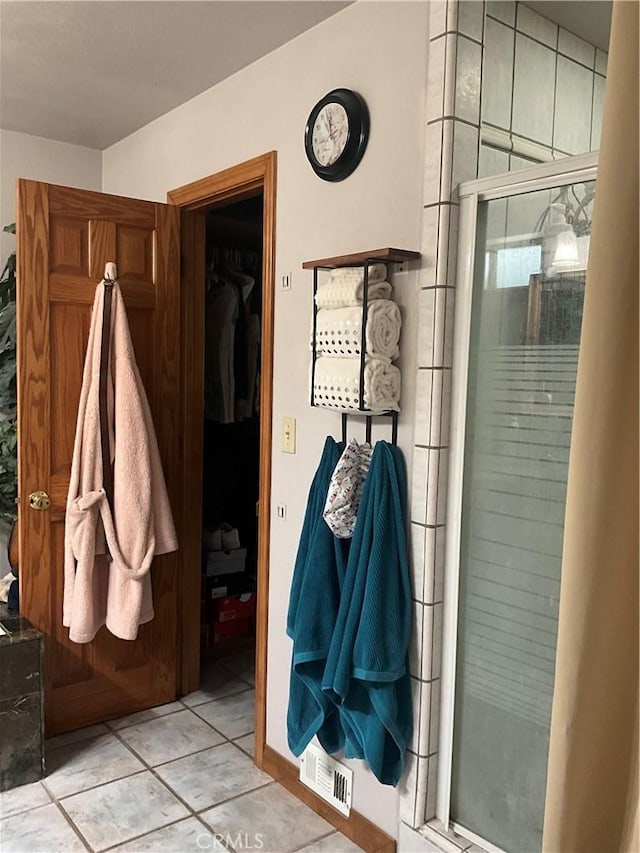 mudroom with light tile patterned floors