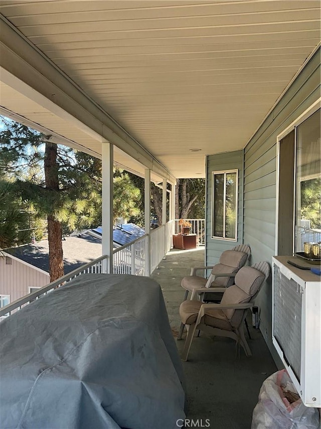 view of patio featuring a balcony