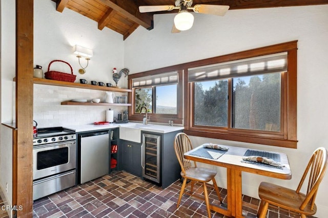 kitchen featuring sink, dishwasher, stainless steel range with electric stovetop, wine cooler, and tasteful backsplash