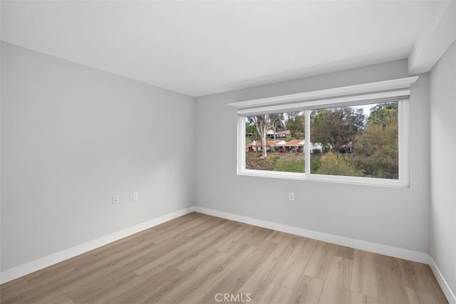 unfurnished room featuring light hardwood / wood-style floors