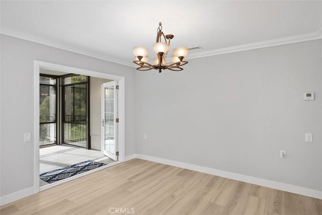 spare room with crown molding and light hardwood / wood-style floors